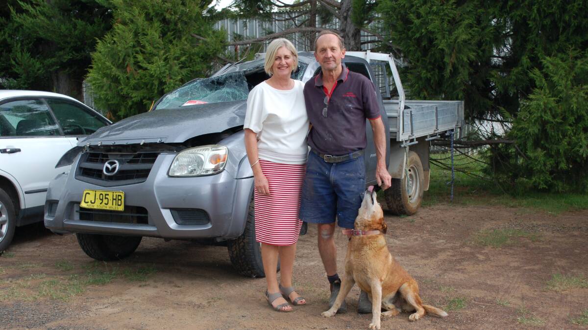 Time for a change: Vicki and Charlie Szpitalak with Rex outside their Smash Repair business. The couple are closing shop after accepting an offer to buy their property.