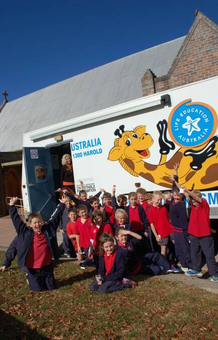 St Patrick's Primary School students outside the Healthy Harold van on Tuesday. Walcha Preschool also attended a session while the facility was in the school grounds.