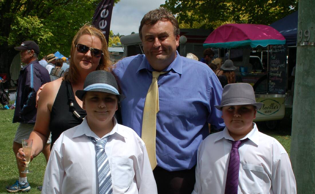 Michael Heazlett aka 'Mr H' with his wife Sally and sons Austin and Luke at the Walcha Races in February.