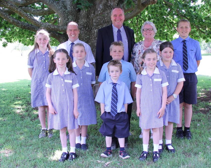 Deputy Prime Minister Barnaby Joyce with Yarrowitch Primary School principal Sarah Carter and her students in the school grounds recently.