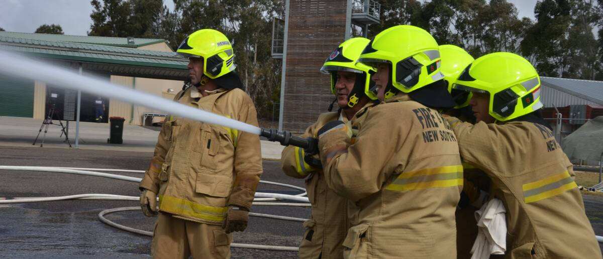 Fire and Rescue NSW recruits in action during the second stage of their prepartion for firefighting at the Armidale training centre last Friday.
