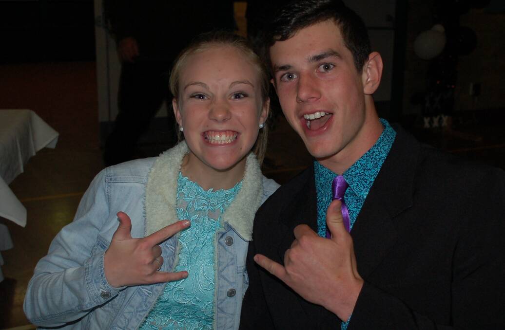 Abbey Mackaway and Jack McAlister giving the I Love You sign........