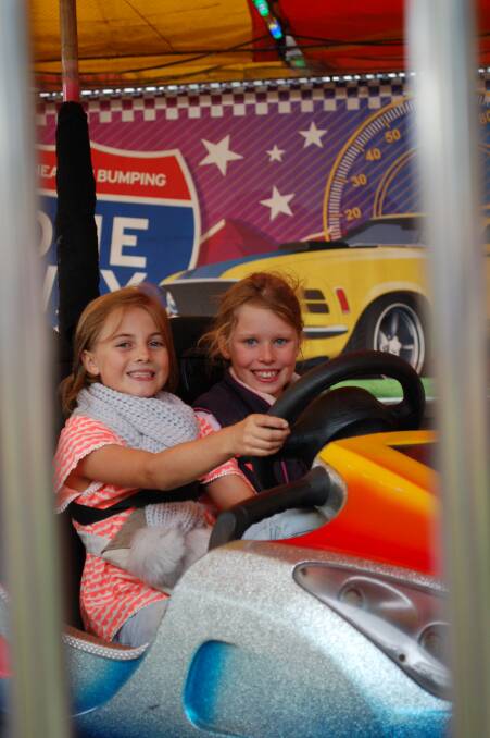 Start your engines: Mimi McLaren and Tempe Macarthur-Onslow enjoy the dodgems. Ride operators say the Walcha Show is one of the best on their circuit. 