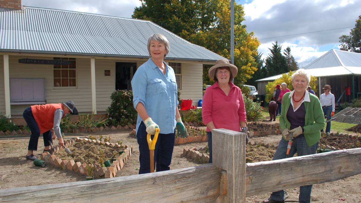Tillers of the earth: Max and Ella Goodridge's daughter Bronwyn with Walcha Garden Club president Julie Ireland and Walcha Historical Society member Collie King working in the garden of the Walcha Pioneer Cottage Museum