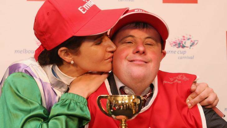 Michelle Payne celebrates her winning ride with brother and strapper Stevie Payne. Photo: Michael Dodge. Reminisce more by hitting the photo.