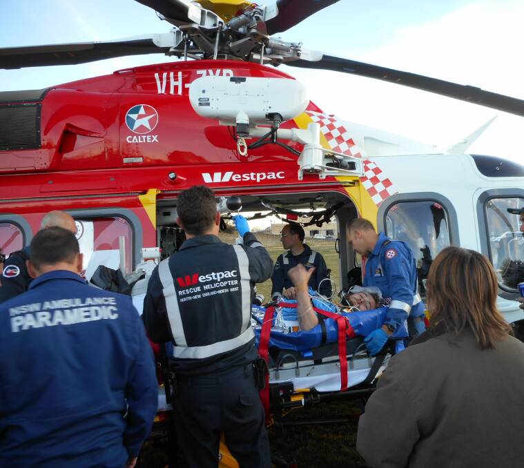 On his way: Ben Green is set to be airlifted from Walcha's home ground after suffering a horror leg injury on the weekend. Photo: Andrew Cross.