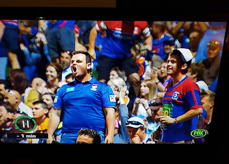 Caught on camera: Footy fans Ben Cross and Lachie Fletcher with Troy LeStande (sunglasses) feature on-screen in the middle at the recent Knights v Tigers match.