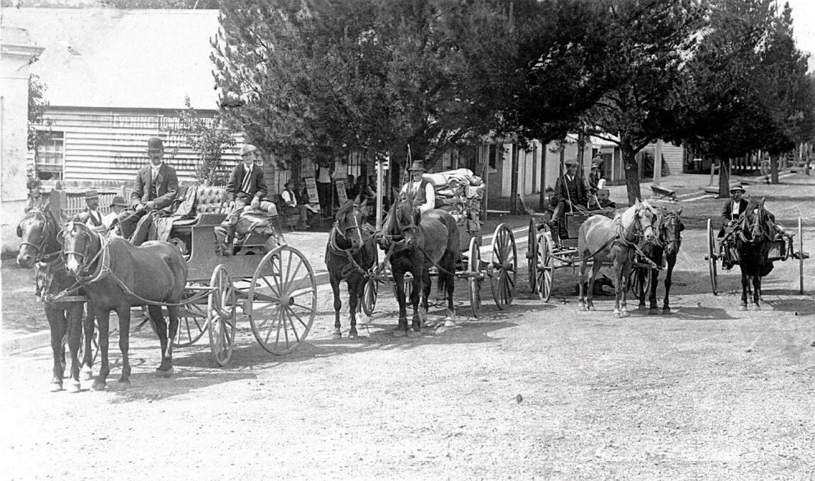 Delivering the mail: A photo from the early 1900s of four of Walcha’s early mail contractors outside the post office in Derby Street.