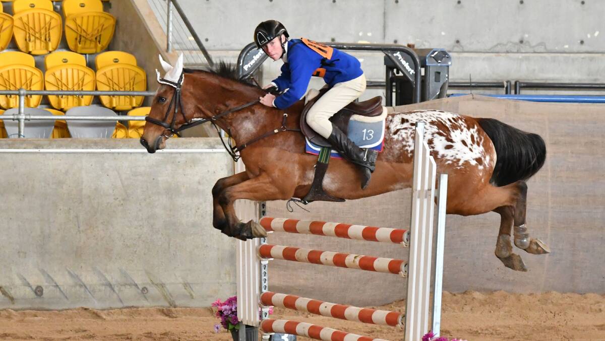 HIGH FLYER: William Wood won the A grade 13 and under-15 years showjumping point score trophy. Photo: Julie Wilson