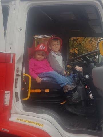 FIRE STATION OPEN DAY: Henry and Nina Blomfield enjoy a ride in the Walcha fire truck as part of the open day that encouraged community members to get involved.
