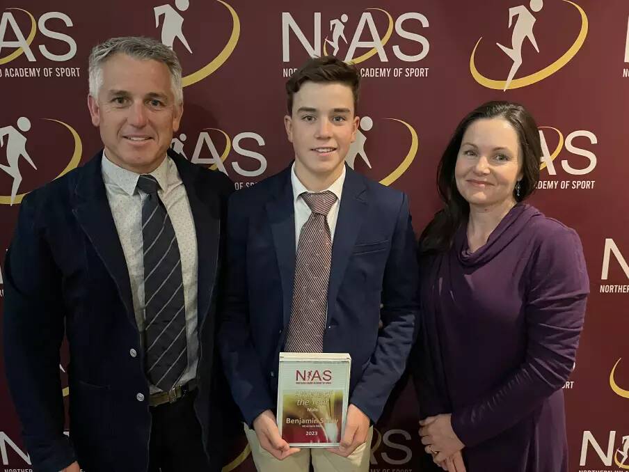 Shaw, pictured here with parents Chris and Amanda, was named NIAS' Male Athlete of the Year for 2023.