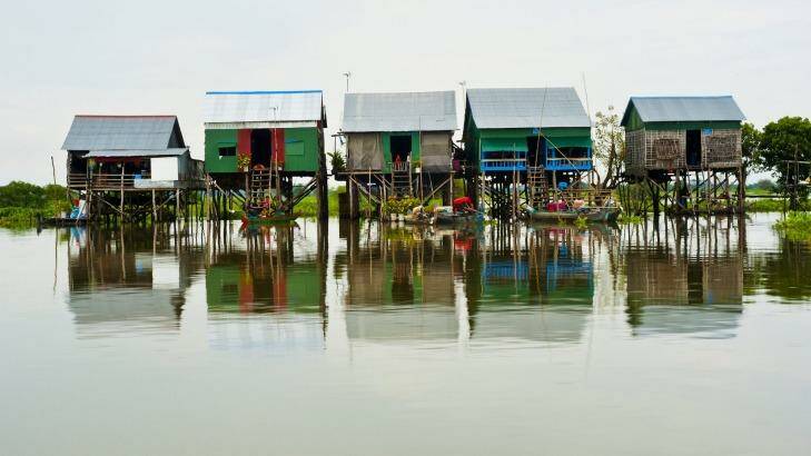 Charming coloured huts on stilts make up this picturesque floating village on Tonle Sap Lake. 