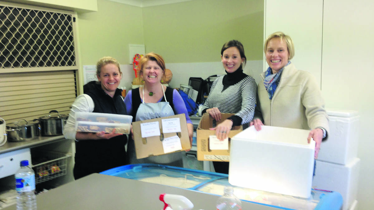 Paula Jenkins, Jenny Sweeney, Amanda Nivison and Anthea Macpherson pack the lunches for delivery.