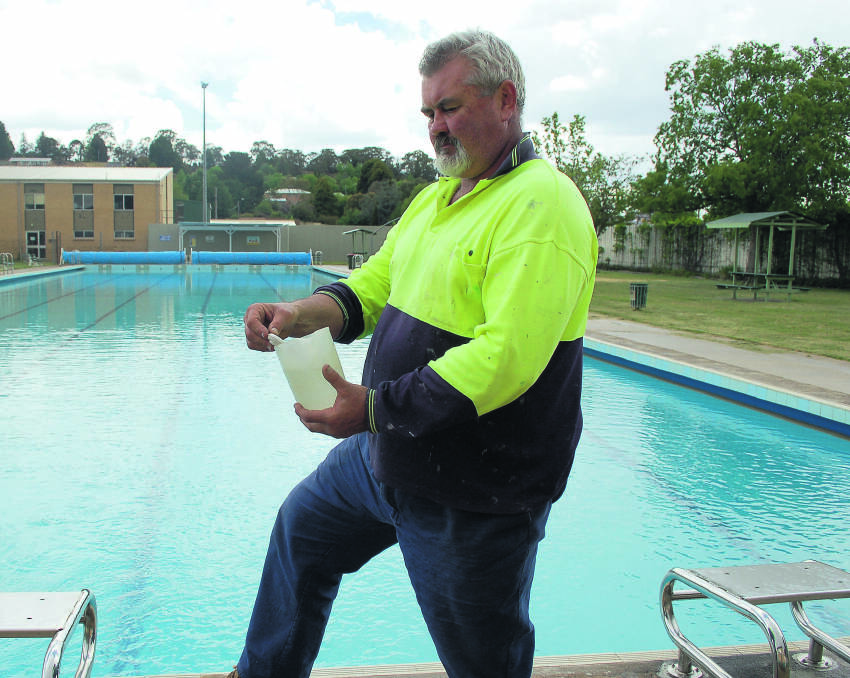 Pool manager AJ Cross pictured here testing the water temperature which was nearly 23.5 degrees.