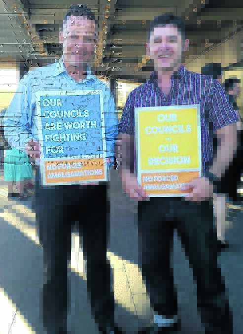 ‘WONDERFUL’: New England Greens candidate Mercurius Goldstein, left, campaigns for standalone councils with Grayndler candidate Jim Casey.