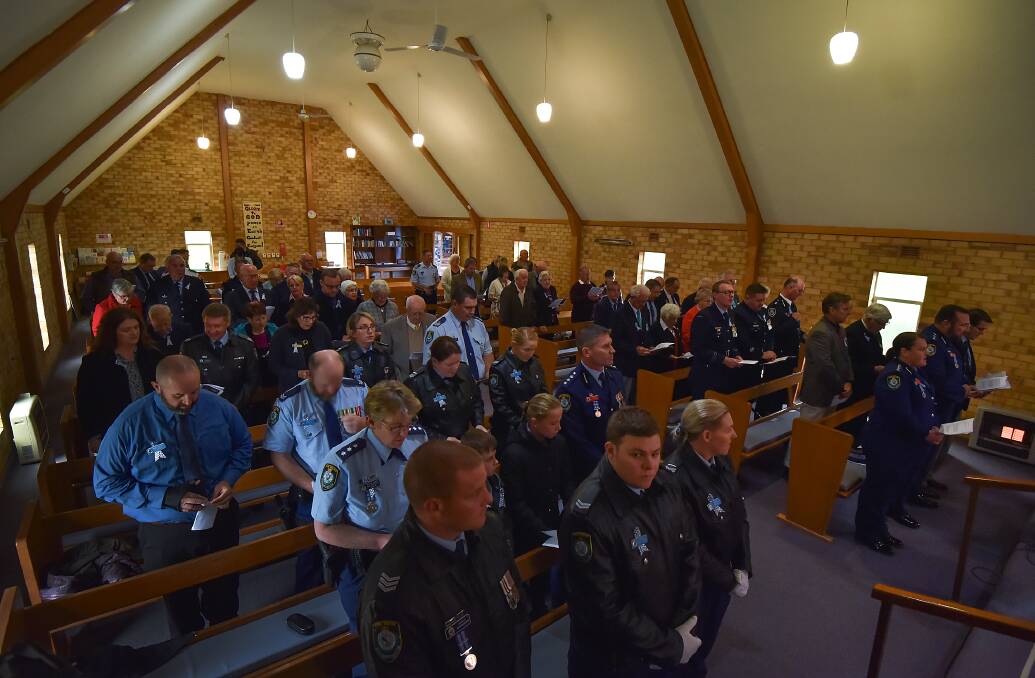 SEA OF UNIFORMS: Oxley Local Area Command police gathered at St Andrew's Anglican Church for the service. 290216GGA04