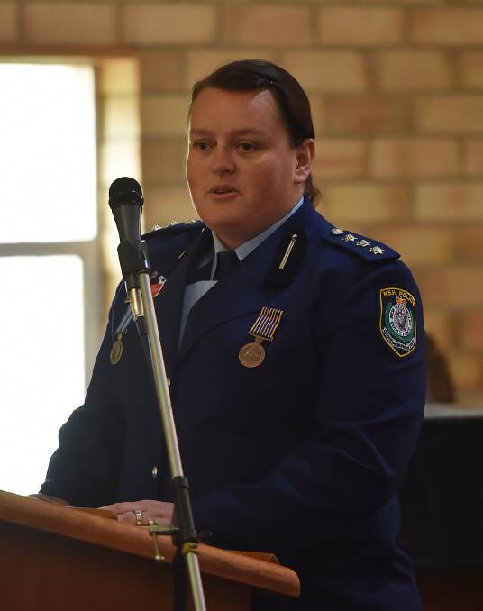 TRIBUTE TO FALLEN: Acting Superintendent Kylie Endemi speaks to those gathered in Walcha. 290916GGA02