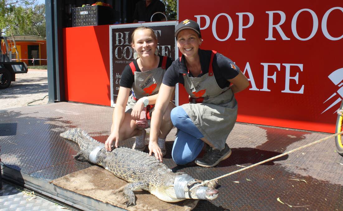 COFFEE BREAK: Pop Rocket Cafe staff Hayley Lye and Chrissy McKie posed with the crocodile.