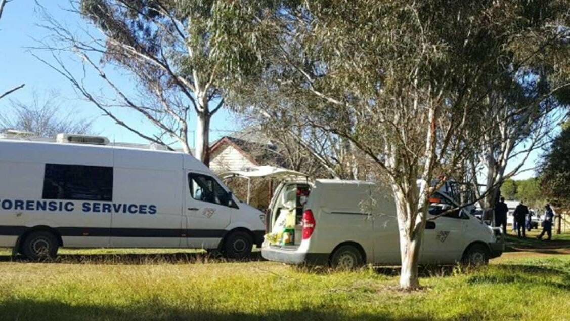 Crime scene: Detectives, police and forensic officers at the property, on the outskirts of Armidale, where the 43-year-old's body was found the morning after his 2017 death.