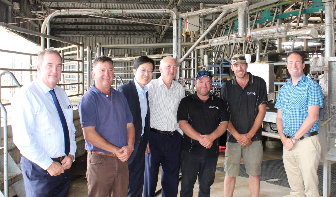 TURNING UP THE VOLUME: Tony Zhang at the Walcha Dairy with Eric Noakes, Scott Kermode, Bill Heazlett, Nick Bullen, Beau Duncan and export adviser Rob Harrison.