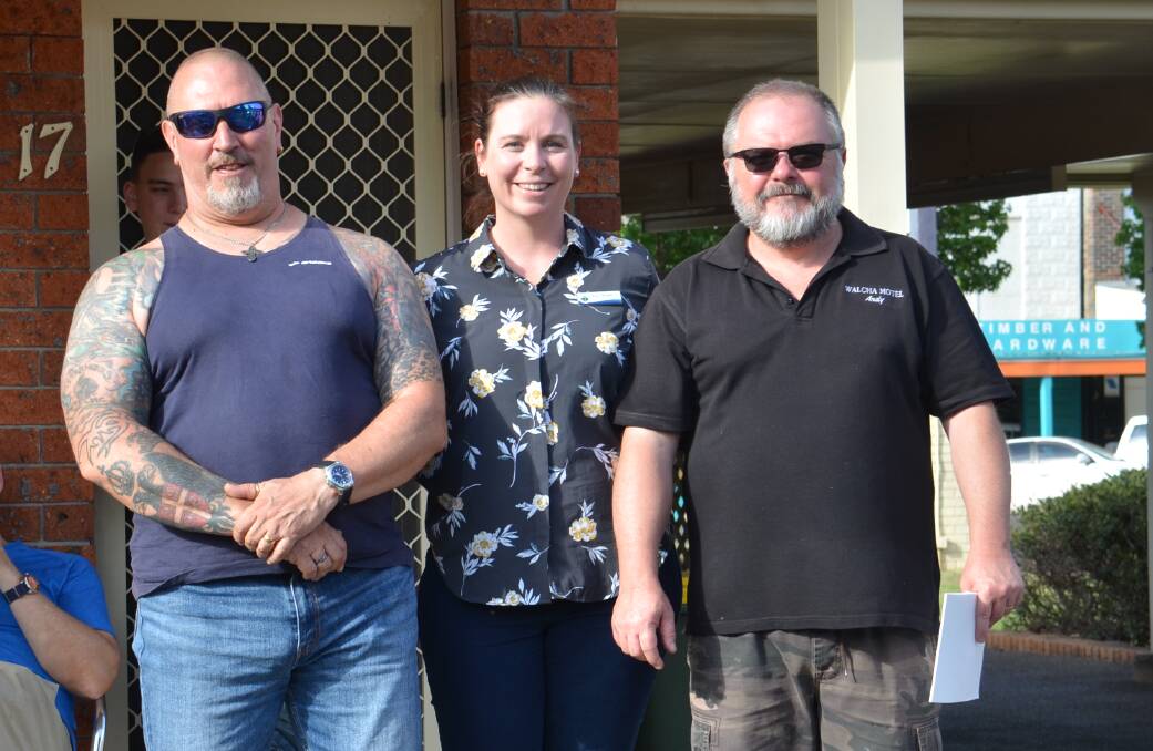 ALL HEART: Walcha Fire Run organiser Boris Mihailovic and Walcha Motel proprietor Andy Wright give the money to Walcha Council general manager Anne Modderno at the motel on Friday.