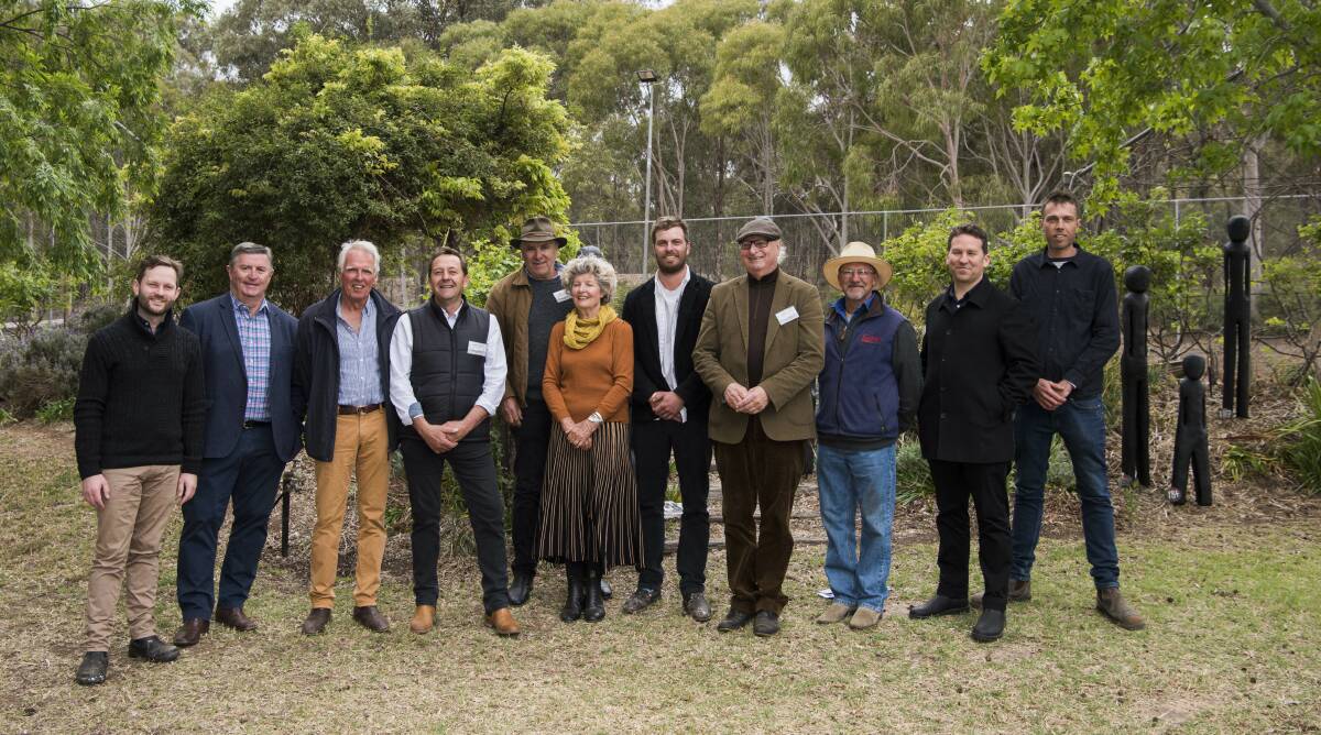 THE CREATIVE SET: Ben Tooth centre, with fellow Walcha sculptor Stephen King to his right, fellow Sculpture in the Garden exhibition artists and the 2019 judges.