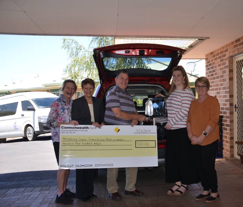 SMILES ALL ROUND: Commonwealth Bank Walcha branch manager Anne Martin makes a home delivery