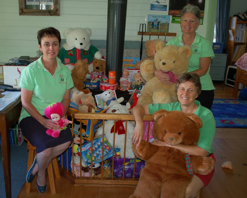Sam Goor, Kylie Dunn and Jennifer Latham with some of the toys donated.last Christmas
