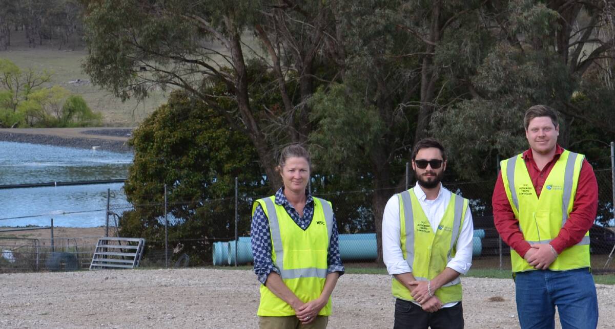 The Walcha Council Wastewater team: Tess Dawson, senior manager water, sewer & waste, Sean Perkins, project officer and Dylan Reeves, director of engineering standing in front of the renovated tertiary treatment pond and the newly installed pond.