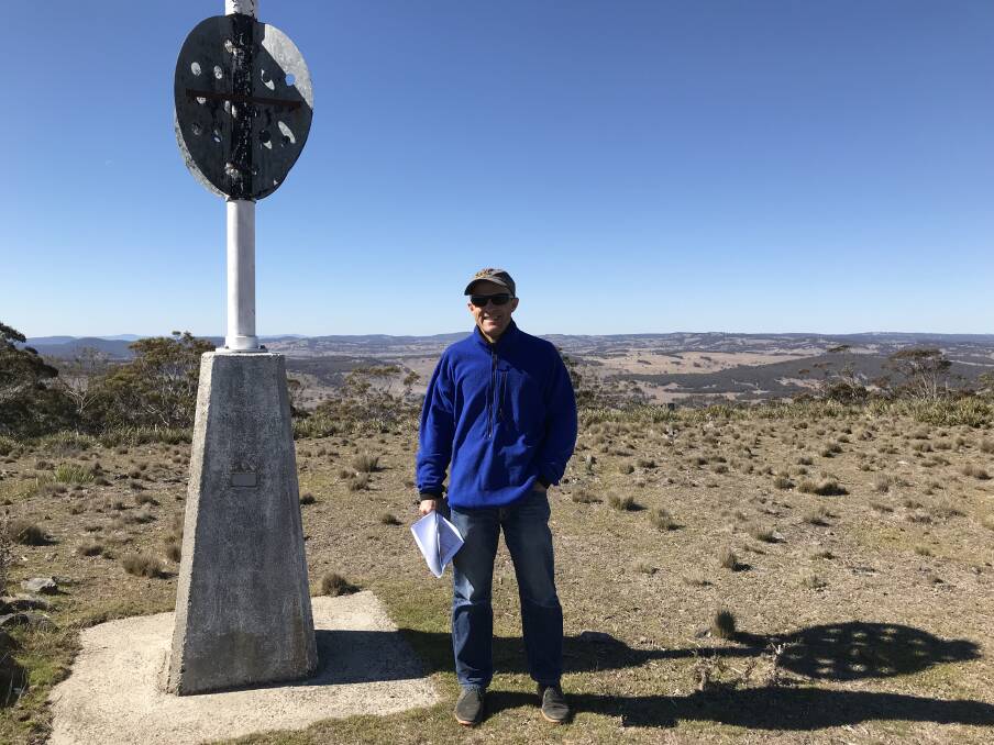 BLUE SKY MINING: Winterbourne Wind project director Doug Landfear stands in part of the Winterbourne Wind harvest area next to the Blue Mountain trigpoint state survey marker