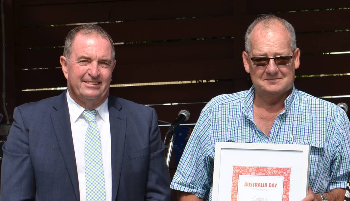 Walcha mayor Eric Noakes with Walcha's citizen of the year Brian Smith on Sunday at the Australia Day breakfast awards - Mr Smith says the RFS is still to pay his company for contract work carried out during the recent fires.