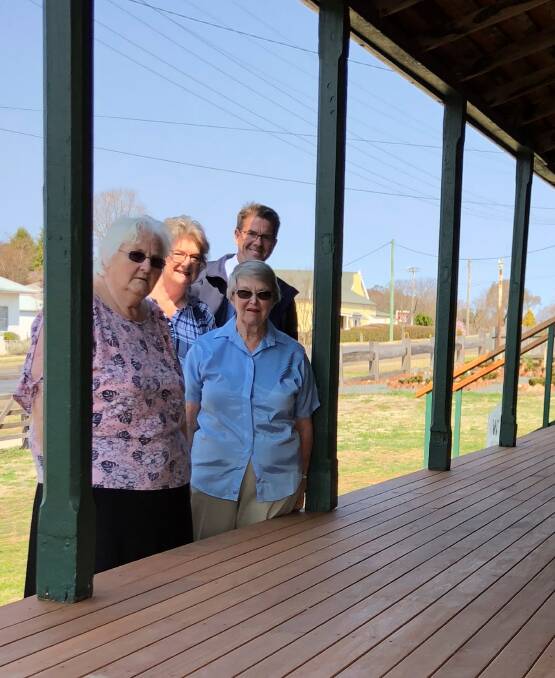 MP Kevin Anderson and Walcha Historical Society members Kate Hoy, Jane Morrison and Kerry Dickson inspect the newly installed verandah at the Walcha Pioneer Cottage Museum