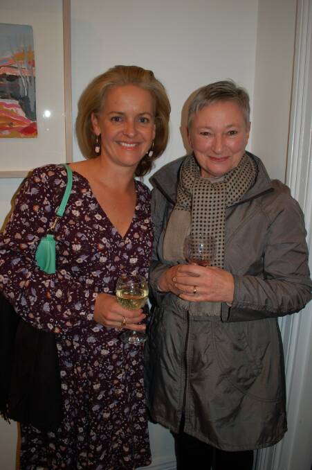 Lovely landscape: Paula Jenkins with Moira Lloyd on Friday night. There are still works available from WGoA according to proprietor Carley McLaren