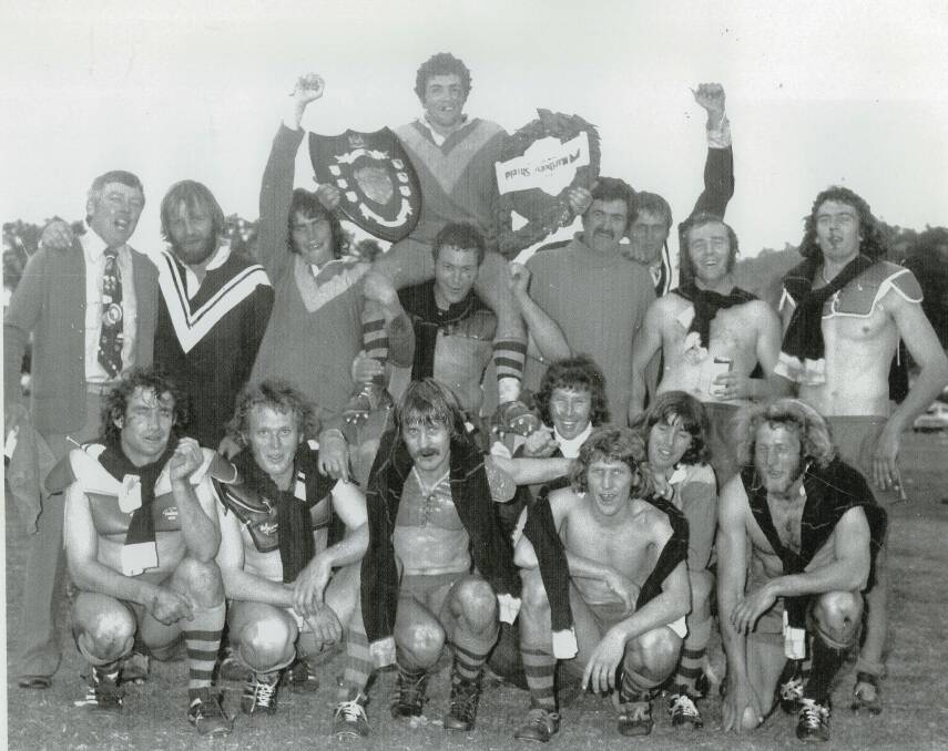 Winners are grinners: The victorious 1975 premiers - Walcha Roos with coach Marty Williamson (far left).