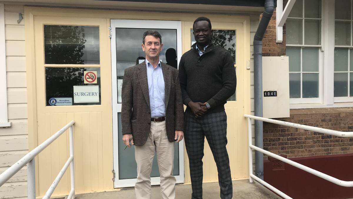 HEALTH ADVICE: Dr Adrian Allen and Dr Deng Abiem outside their Walcha office.