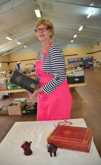 Mrs Reardon with the (large) Shorter Oxford Dictionary that is being sold by silent auction
