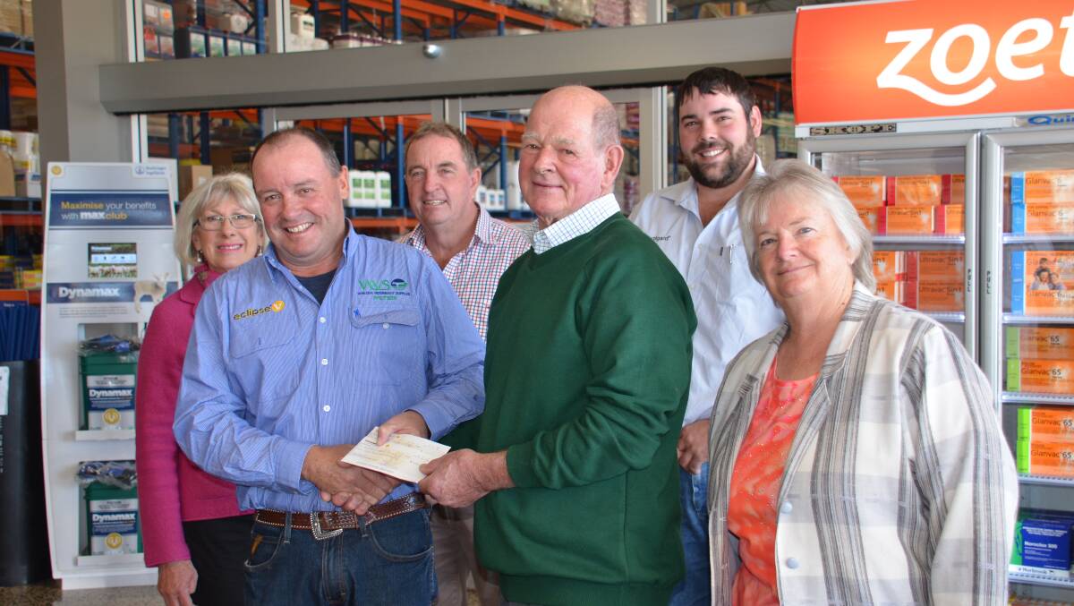 THE GIFT OF GIVING: Walcha Vet Supplies local hero recipient Allan Morris with Peter King, Zoetis rep Kurt Parker, Cheryl Margery, Eric Noakes and Carolyn Salter