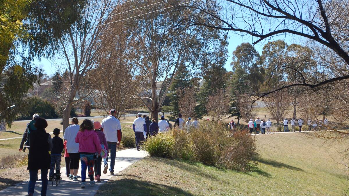 Get on your feet: Participants set off for the second Walcha Bridge to Bridge which is a 6km walk along the levee bank of the Apsley River. The last Memory Walk was in 2012.