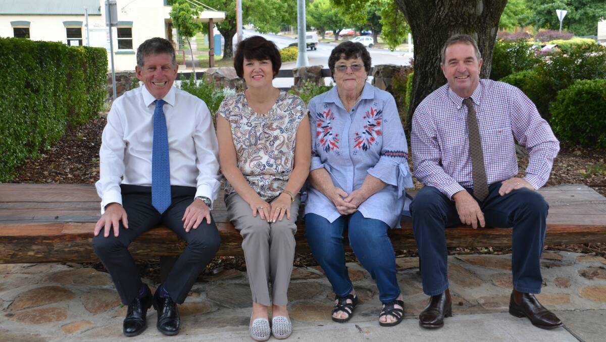 Walcha Council general manager Jack O'Hara with Aurora Reilly and Mary Hoare from Quota International and Walcha Mayor Eric Noakes on one of the new seats. 