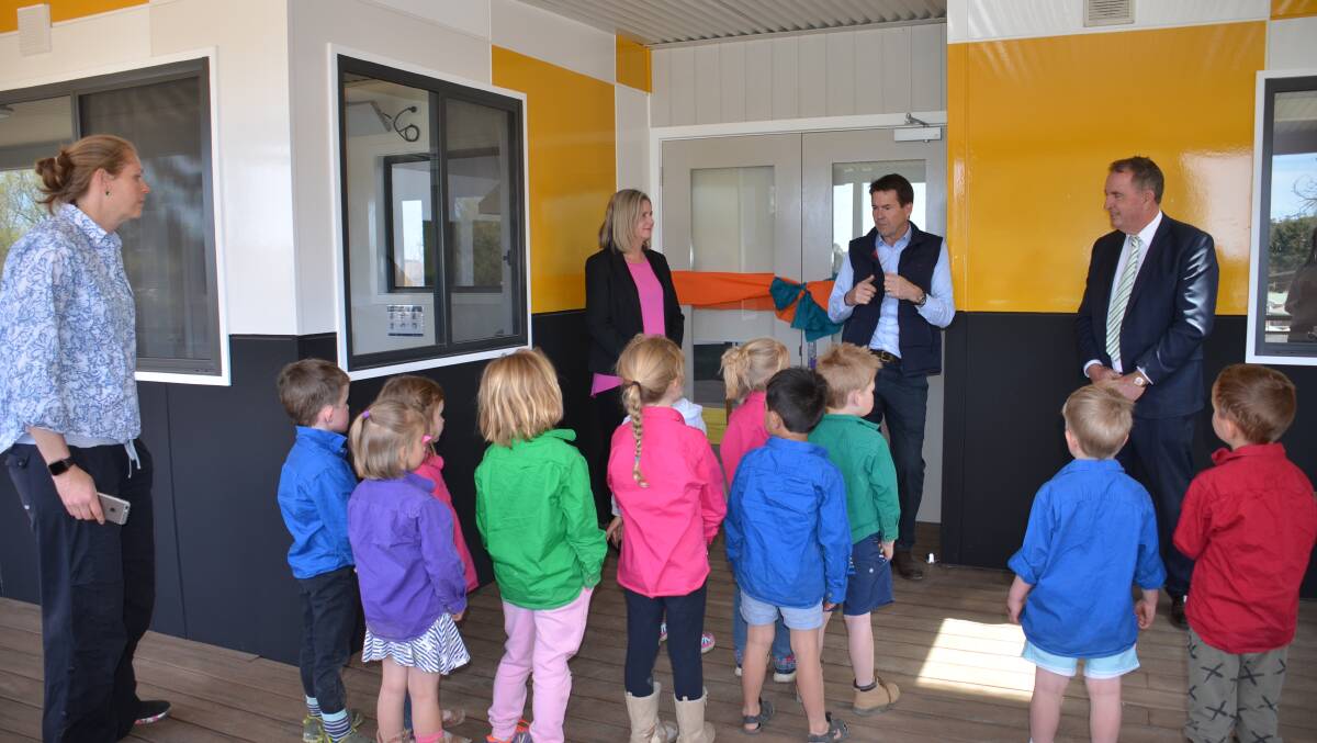 CHILD'S PLAY: Kevin Anderson speaks to the students before he officially cuts the ribbon on the new Walcha Preschool building. Photo: Vanessa Arundale