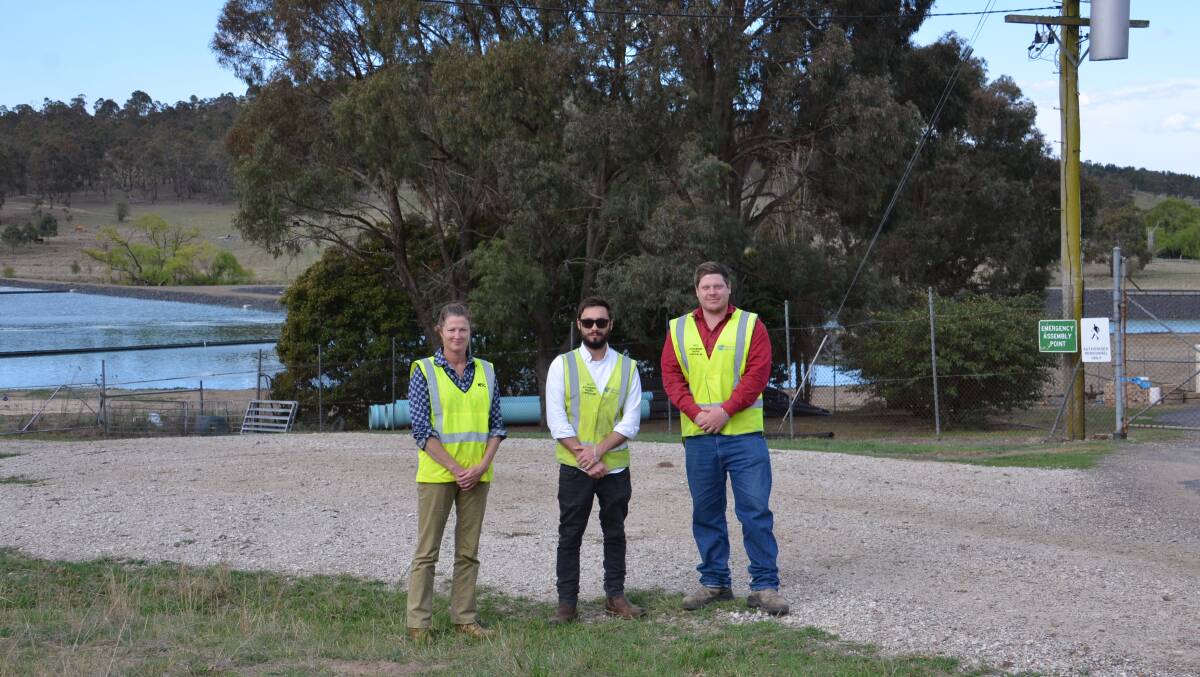 The Walcha Council Waste Water team: Tess Dawson, senior manager – water, sewer & waste, Sean Perkins, project officer and Dylan Reeves, director of engineering standing in front of the renovated tertiary treatment pond and the newly installed pond.