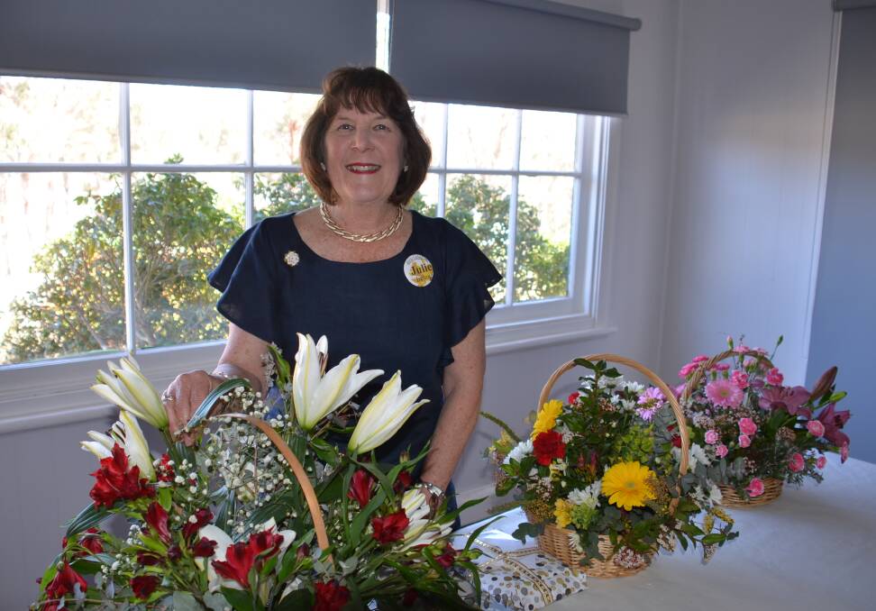 FLOWER GIRL: Julie Ireland in the Walcha Golf Club last Saturday following the unexpected announcement of her award. Fellow members say the Walcha Garden Club has grown well under her nurturing leadership.