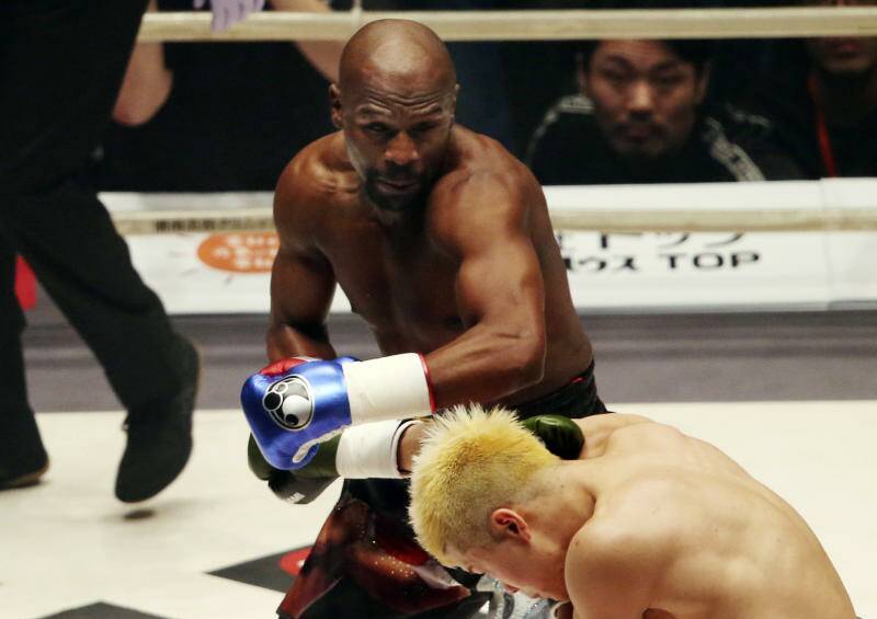 Floyd Mayweather Jr. delivers his left to Japanese kickboxer Tenshin Nasukawa, during their three-round exhibition match.