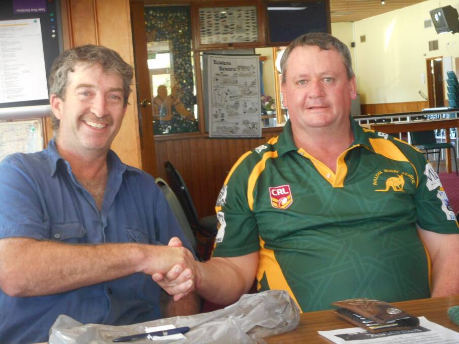 Ready for a new season: Outgoing Roos president Peter Berry wishes Michael Aspinall all the best.