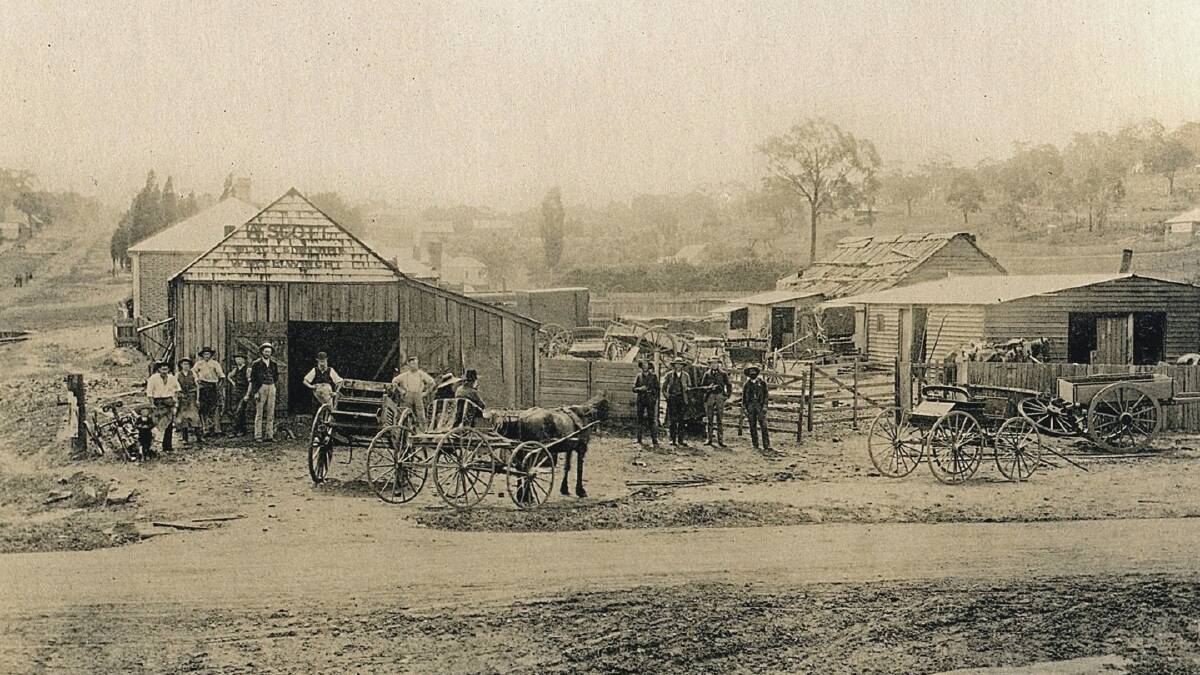 Different era: Derby Street is in the foreground of this old photo of Bill Scott’s smithy. A portion of Fitzroy Street can be seen on the left hand side. Landmark-Boulton’s now occupies the site.