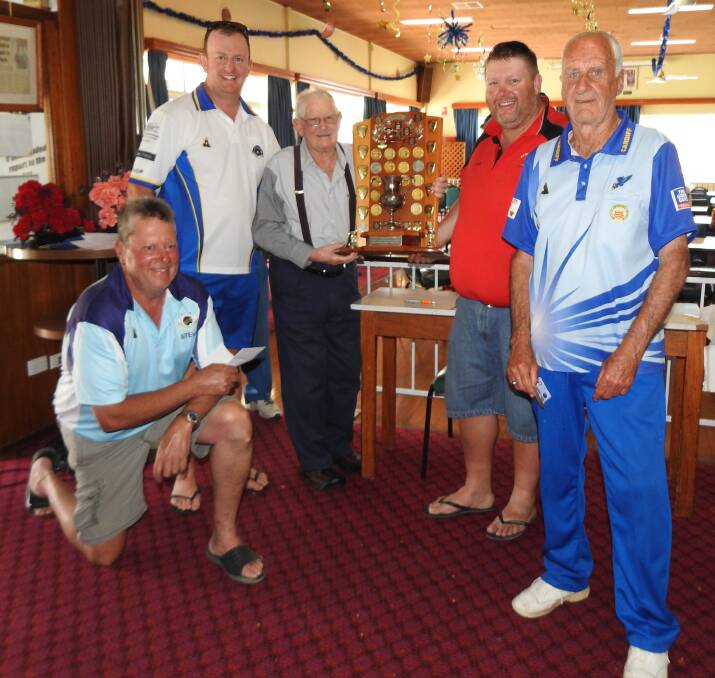 Bowls winners: Steve and Kyle Goodwin, Jamie Kerr and John McLean receive their prize from original tournament organiser Aiden Wall.