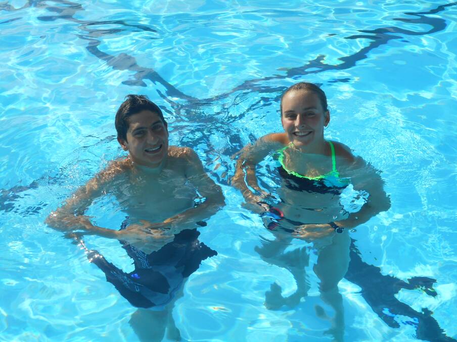 Making a swimming splash: Flippers "Swimmer of the Month" Chyna Smith and fellow record breaker Thomas Micallef during a break from training.
