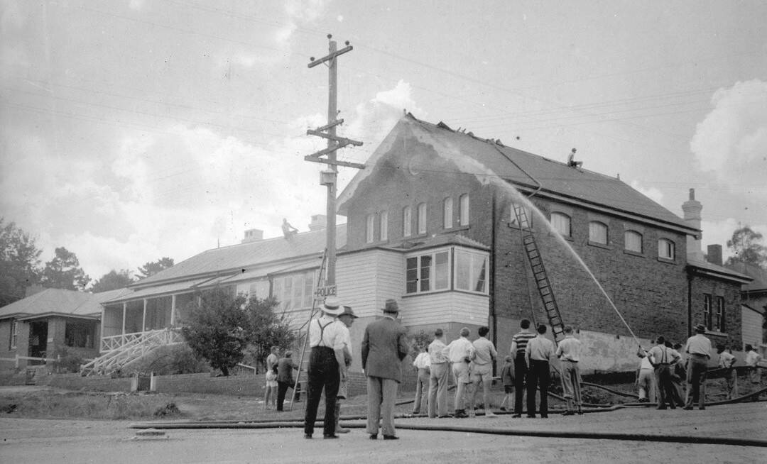 Historic scene: A few spectators attending a minor fire at the Walcha Court House in the second half of the 1900s.