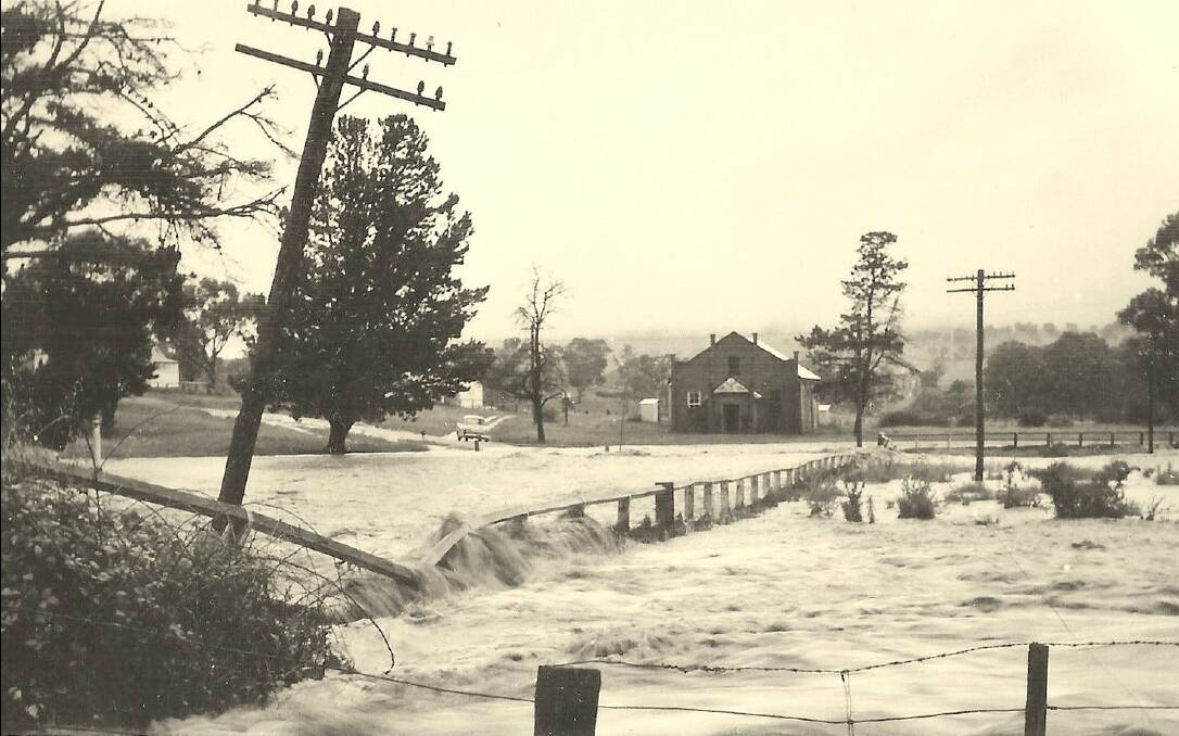 Dramatic scene: Macdonald River flood at Woolbrook on Saturday, January 13, 1962. Photo courtesy of Barbara McHattan.