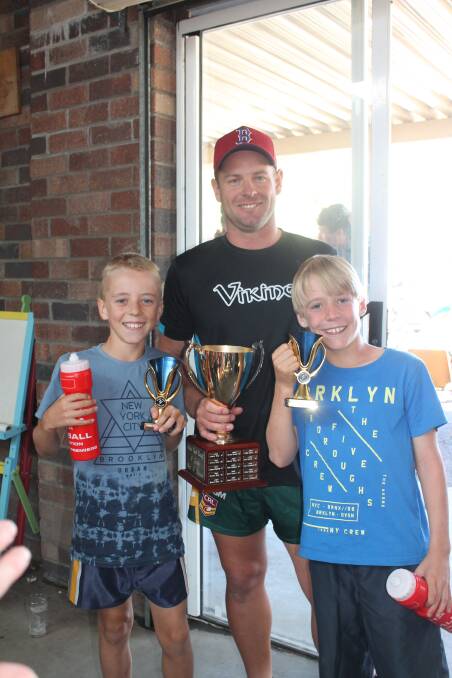 Family fun: A grade touch player of the season Jason Latham flanked by his sons Corbin and Preston who won awards in the junior grade.